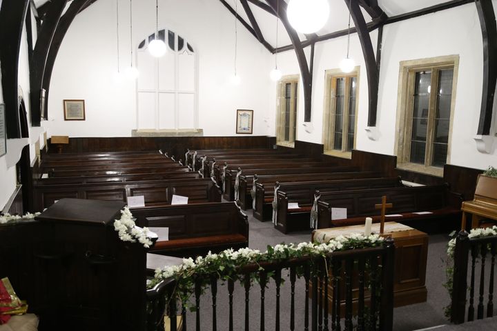 Wincobank Chapel looking towards the wooden pews with original wooden beams and furniture