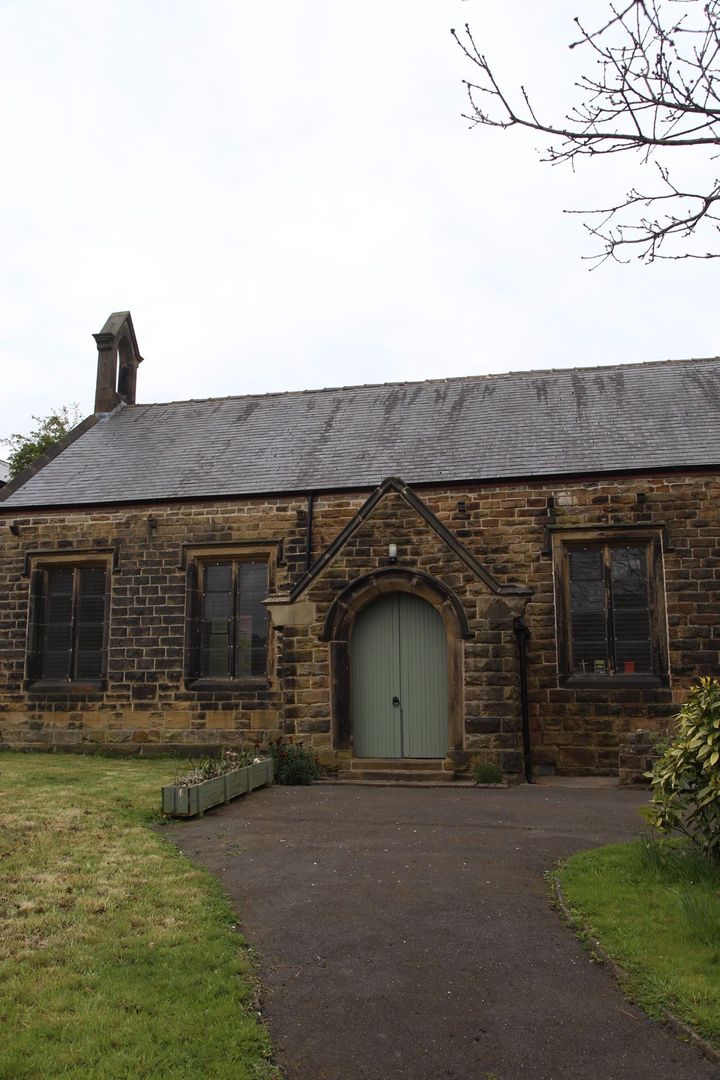 Wincobank Chapel outside rear. An old building with bell and blue wooden door
